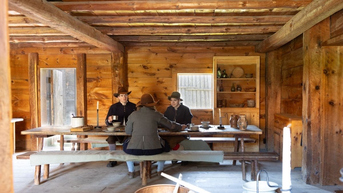 Sainte Marie among the hurons reenacters in a village home dining