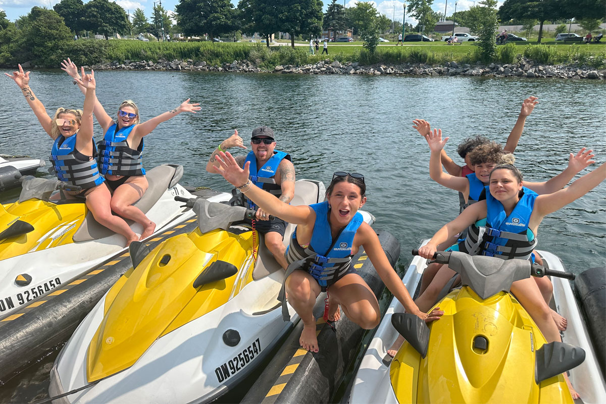People happy on Jet Skis on Barrie's waterfront